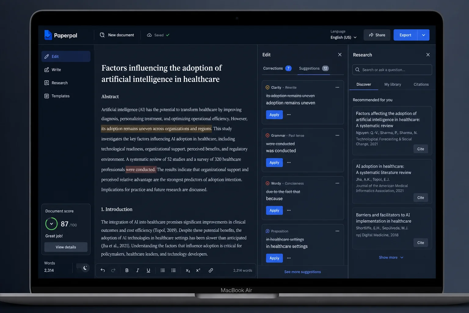 Paperpal AI writing interface on a MacBook with grammar suggestions highlighted and research citation panel visible